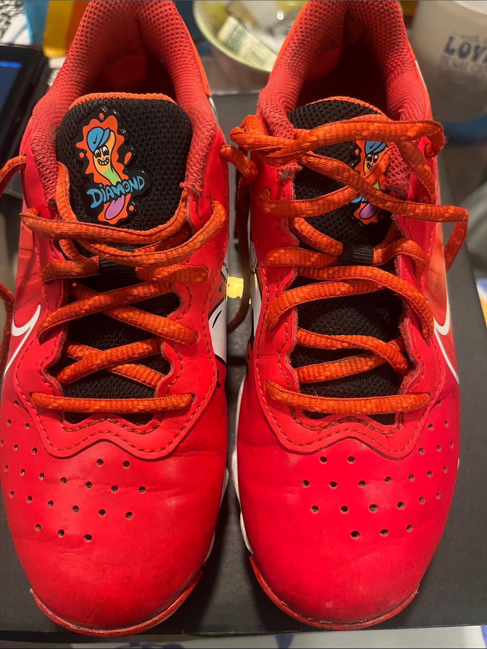 Nike Kids Red Cleats with Orange Laces